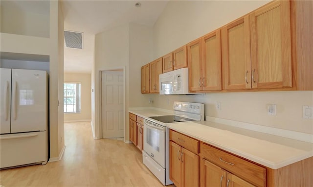 kitchen featuring white appliances, high vaulted ceiling, visible vents, light countertops, and light wood-style floors