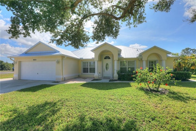 single story home with a front yard, stucco siding, driveway, and a garage