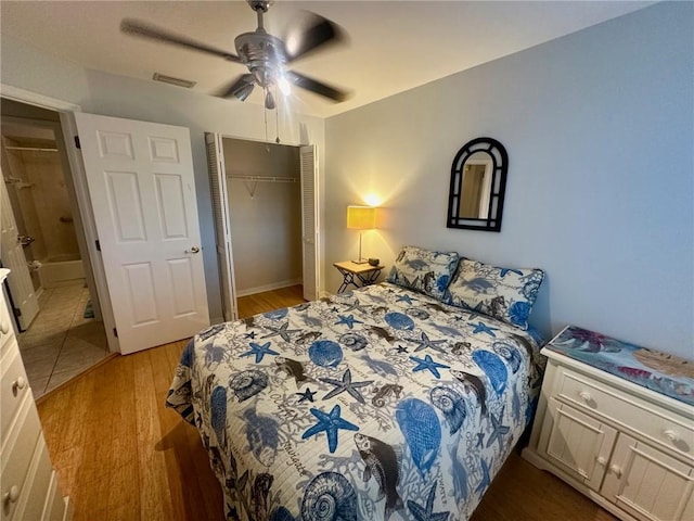 bedroom with ceiling fan, a closet, and hardwood / wood-style floors