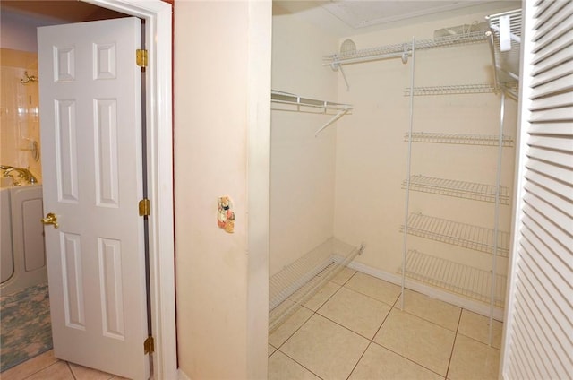 walk in closet featuring light tile patterned floors