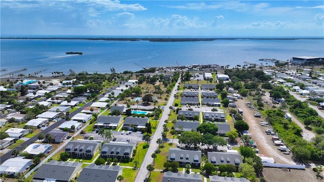 drone / aerial view featuring a water view and a residential view