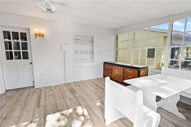 dining room with ceiling fan and wood finished floors