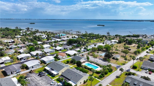 bird's eye view with a water view and a residential view