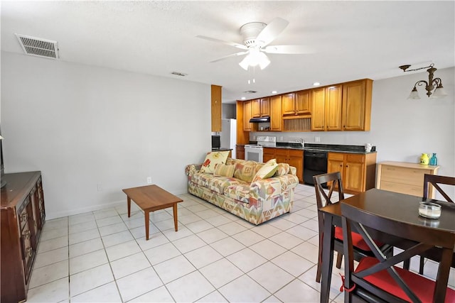 living room with light tile patterned floors, a ceiling fan, recessed lighting, and visible vents