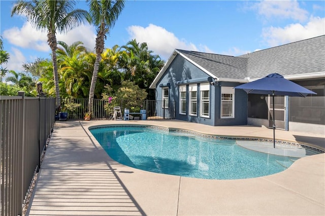 view of swimming pool featuring a fenced in pool, fence, and a patio