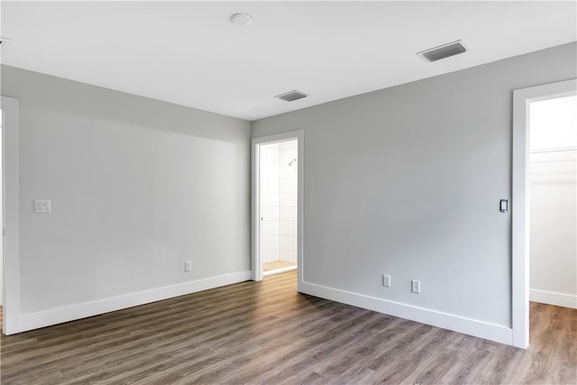 empty room featuring dark wood-type flooring