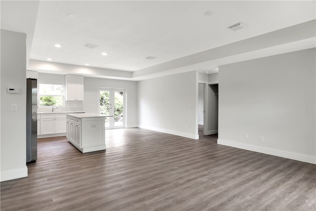 interior space featuring wood-type flooring, sink, and french doors