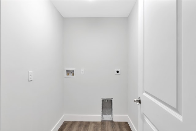 clothes washing area with hookup for an electric dryer, wood-type flooring, and washer hookup