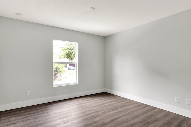 unfurnished room with hardwood / wood-style floors