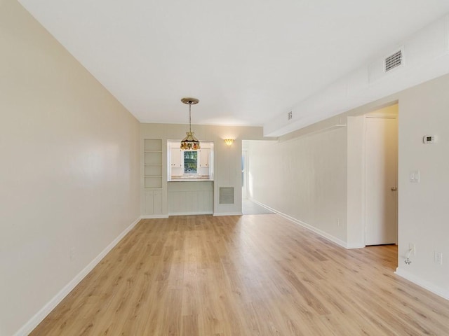 unfurnished room with light hardwood / wood-style flooring