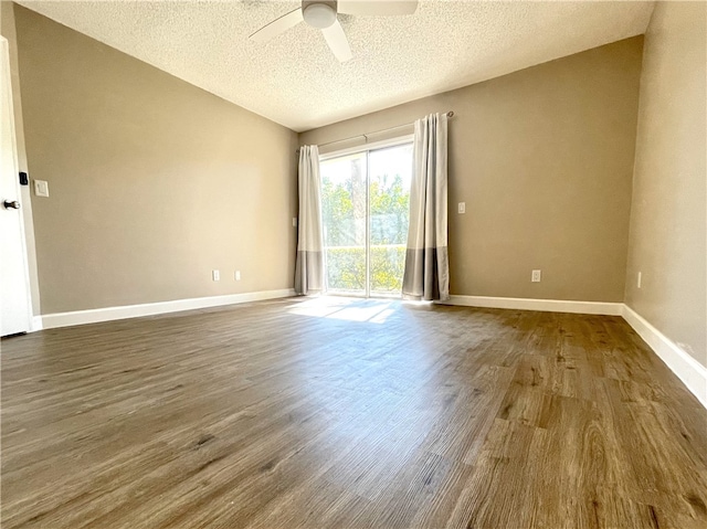 spare room with hardwood / wood-style flooring, ceiling fan, and a textured ceiling