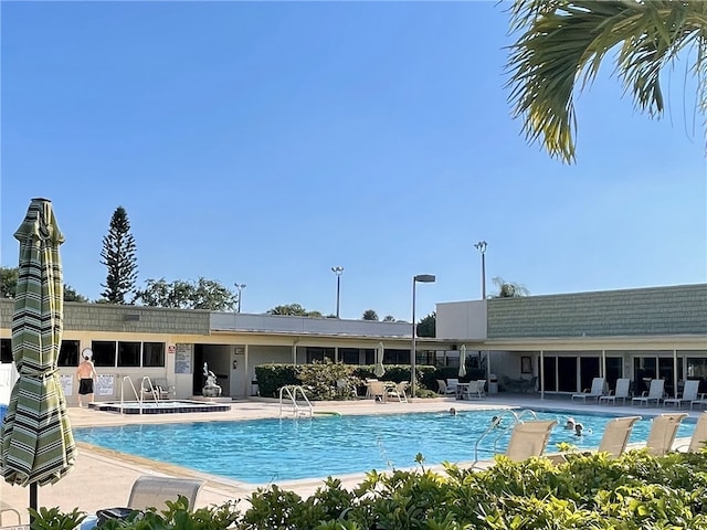 view of swimming pool with a patio area