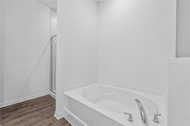 8415 98th Ct, Vero Beach, FL 32967 - bathroom with a garden tub, wood finished floors, and an enclosed shower