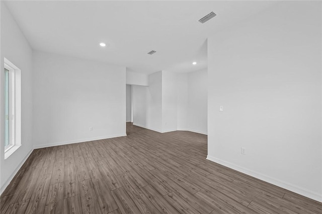 8415 98th Ct, Vero Beach, FL 32967 - unfurnished room featuring dark wood-type flooring and recessed lighting