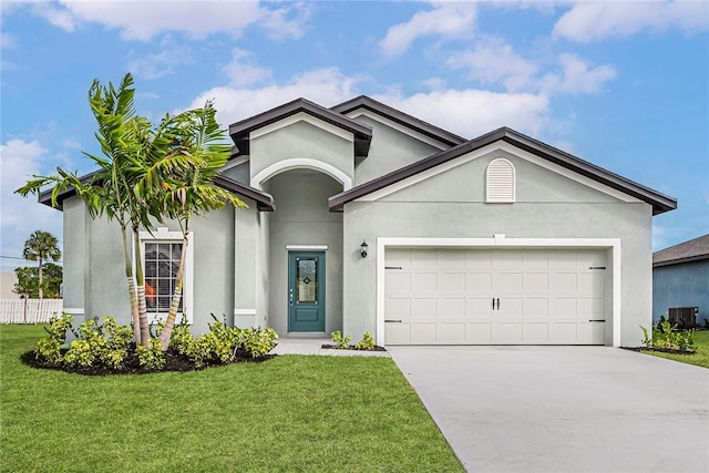 8415 98th Ct, Vero Beach, FL 32967 - ranch-style home with concrete driveway, an attached garage, stucco siding, and a front lawn
