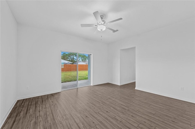8415 98th Ct, Vero Beach, FL 32967 - empty room with ceiling fan and wood finished floors