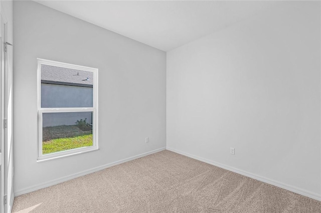 8415 98th Ct, Vero Beach, FL 32967 - carpeted spare room featuring baseboards