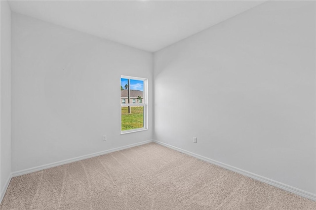8415 98th Ct, Vero Beach, FL 32967 - carpeted spare room featuring baseboards