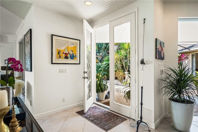 entryway with light tile patterned flooring