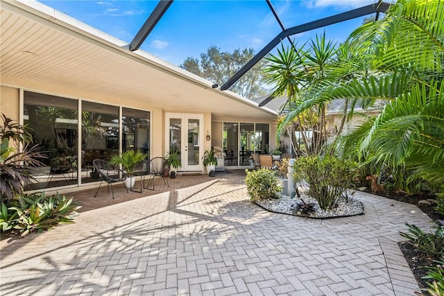 view of patio featuring a lanai