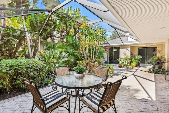 view of patio / terrace with a lanai