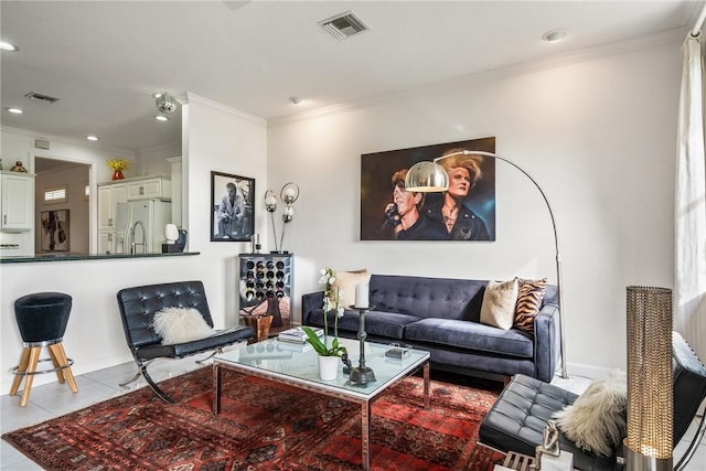 tiled living room featuring ornamental molding