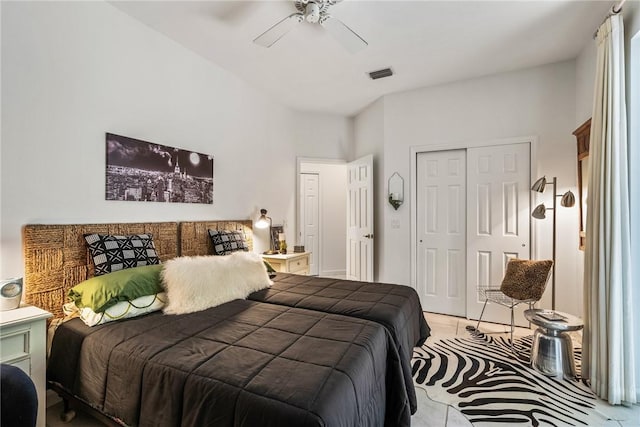 tiled bedroom with a closet and ceiling fan