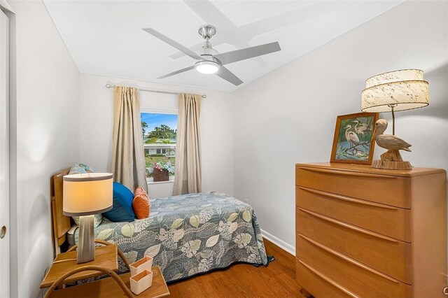 850 Gilbert St, Sebastian, FL 32958 - bedroom with wood finished floors, baseboards, and a ceiling fan