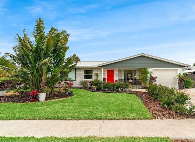 ranch-style house with a garage, brick siding, concrete driveway, and a front lawn