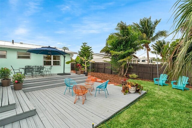 850 Gilbert St, Sebastian, FL 32958 - wooden deck with outdoor dining space