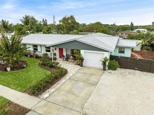 850 Gilbert St, Sebastian, FL 32958 - ranch-style home featuring concrete driveway, an attached garage, and metal roof