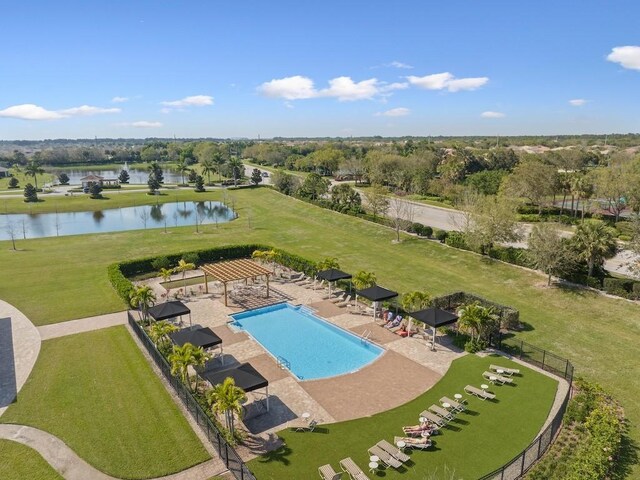 view of swimming pool with a gazebo, a patio, fence, and a water view