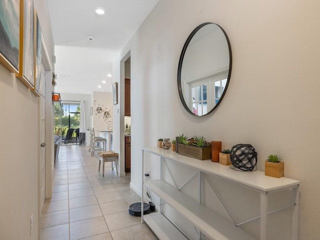 corridor featuring light tile patterned floors and recessed lighting