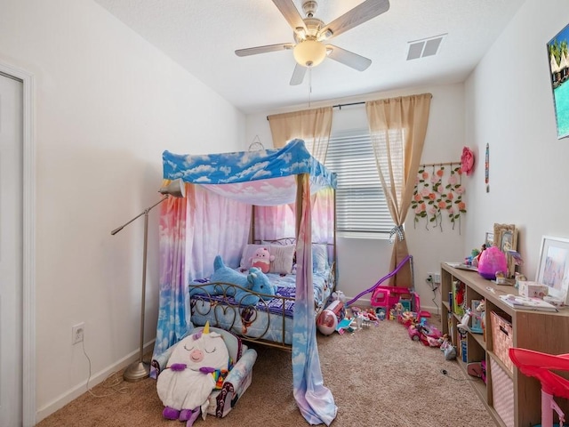 bedroom featuring visible vents, baseboards, carpet, and a ceiling fan