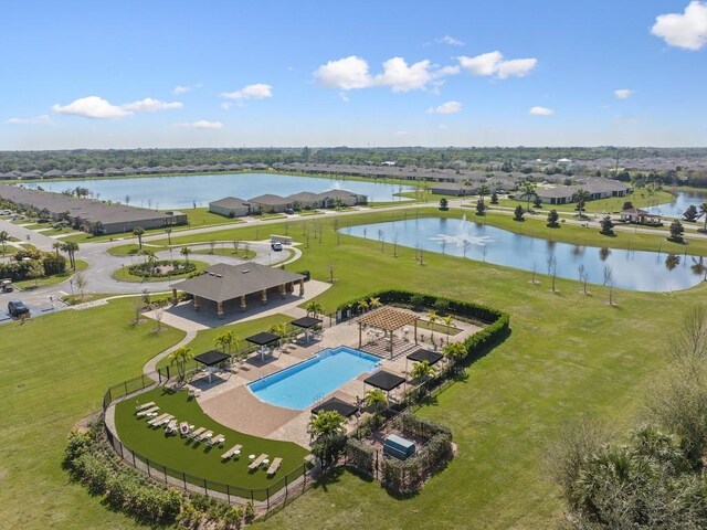 birds eye view of property with a water view