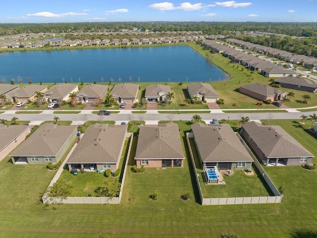 drone / aerial view featuring a residential view and a water view