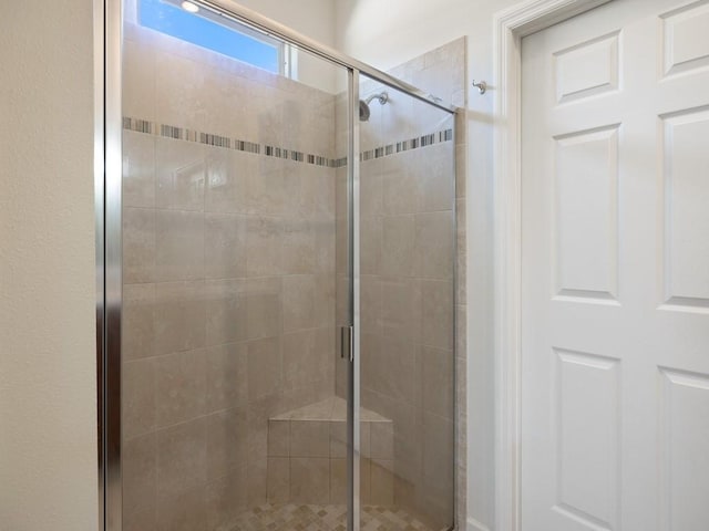 bathroom featuring a stall shower