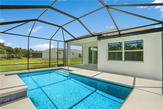 view of pool featuring a patio area, a yard, and a lanai