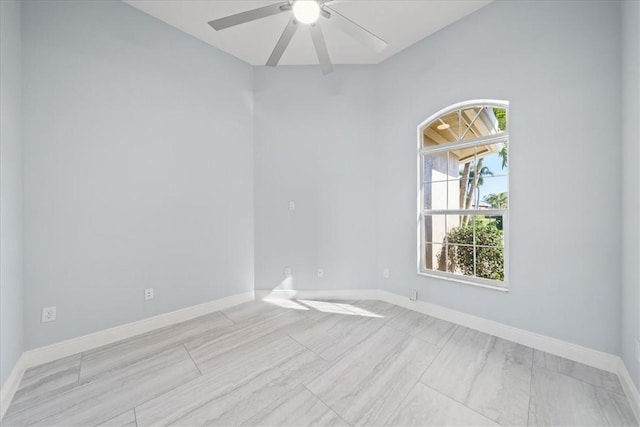 spare room with ceiling fan