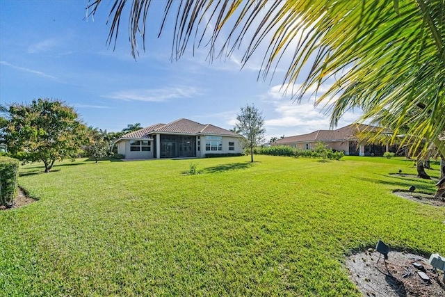 view of yard with a sunroom