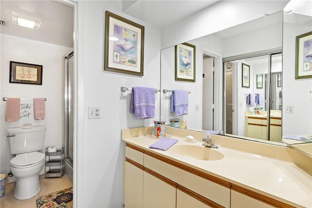 full bathroom with bath / shower combo with glass door, tile patterned floors, toilet, and vanity