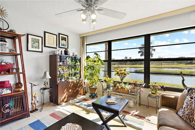 interior space featuring a water view and ceiling fan