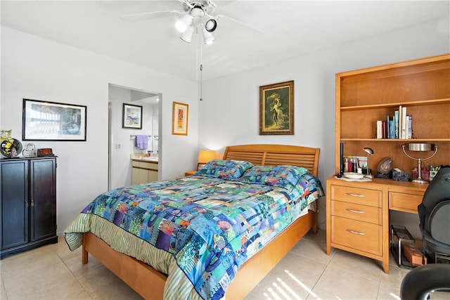 tiled bedroom featuring connected bathroom and ceiling fan