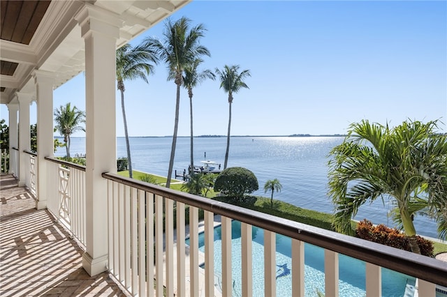 balcony featuring a water view