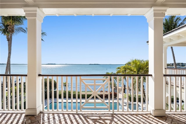 balcony featuring a water view