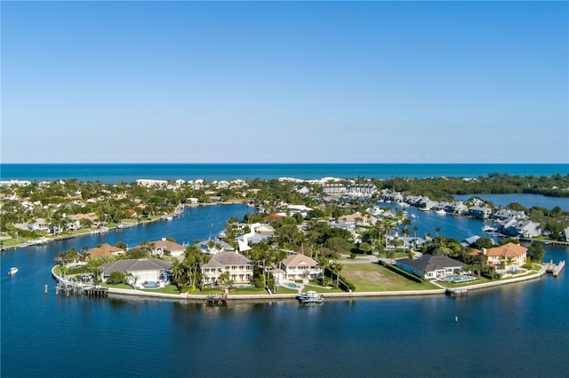 aerial view featuring a water view and a residential view