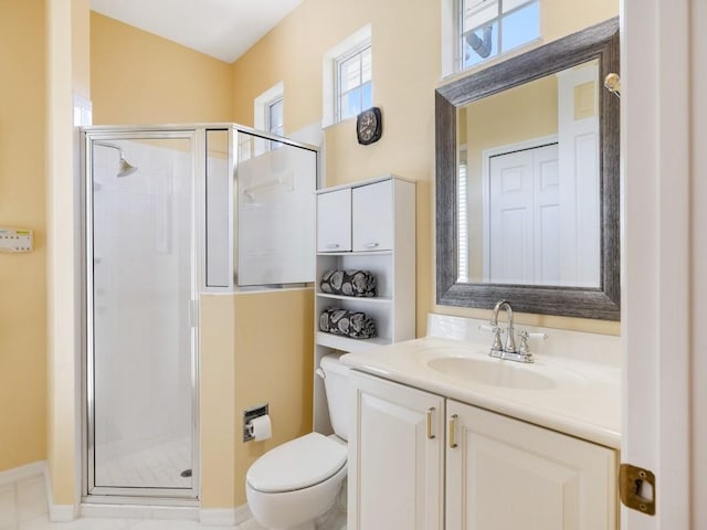 bathroom with vanity, an enclosed shower, and toilet