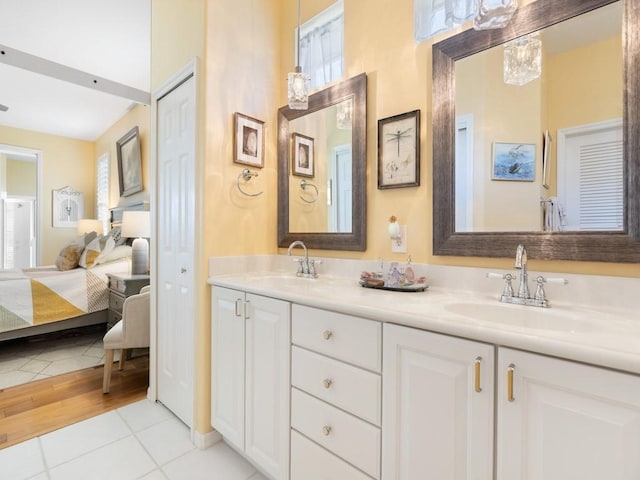 bathroom with tile patterned flooring and vanity