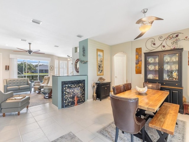 dining area featuring ceiling fan and light tile patterned flooring