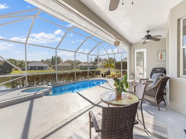 view of pool featuring ceiling fan, a lanai, a patio, and a water view